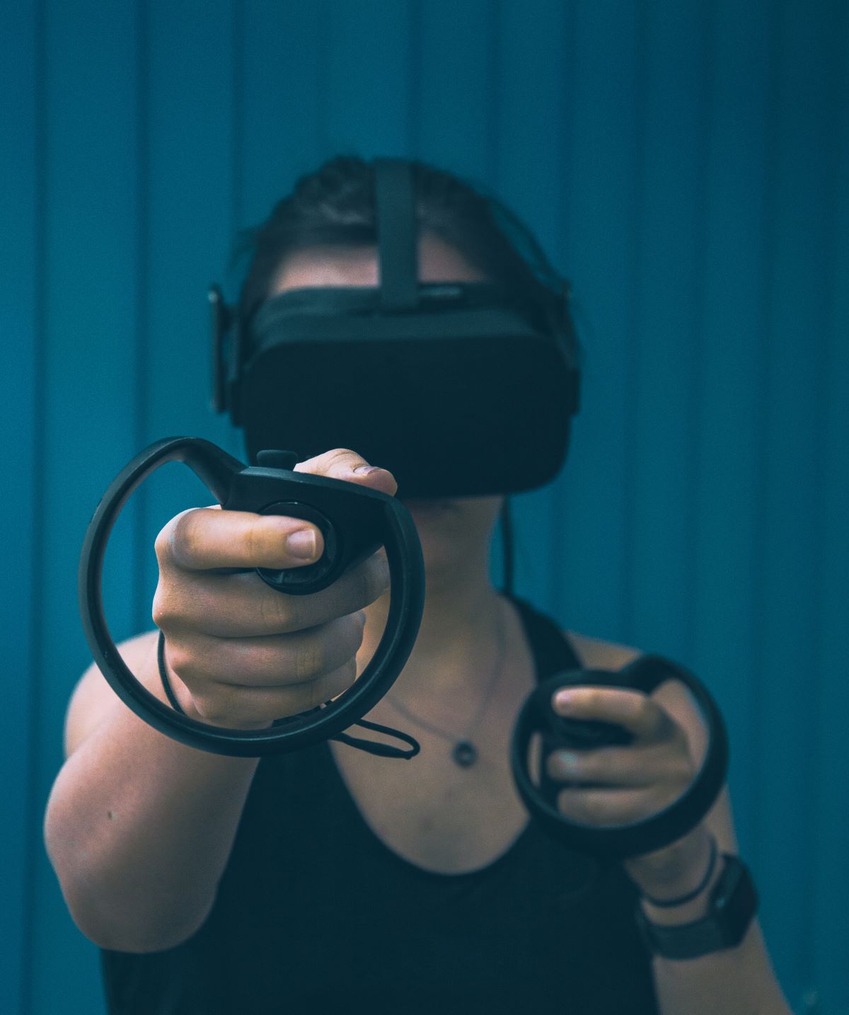 A person wearing a virtual reality headset; photo by Christine Sandu on Unsplash